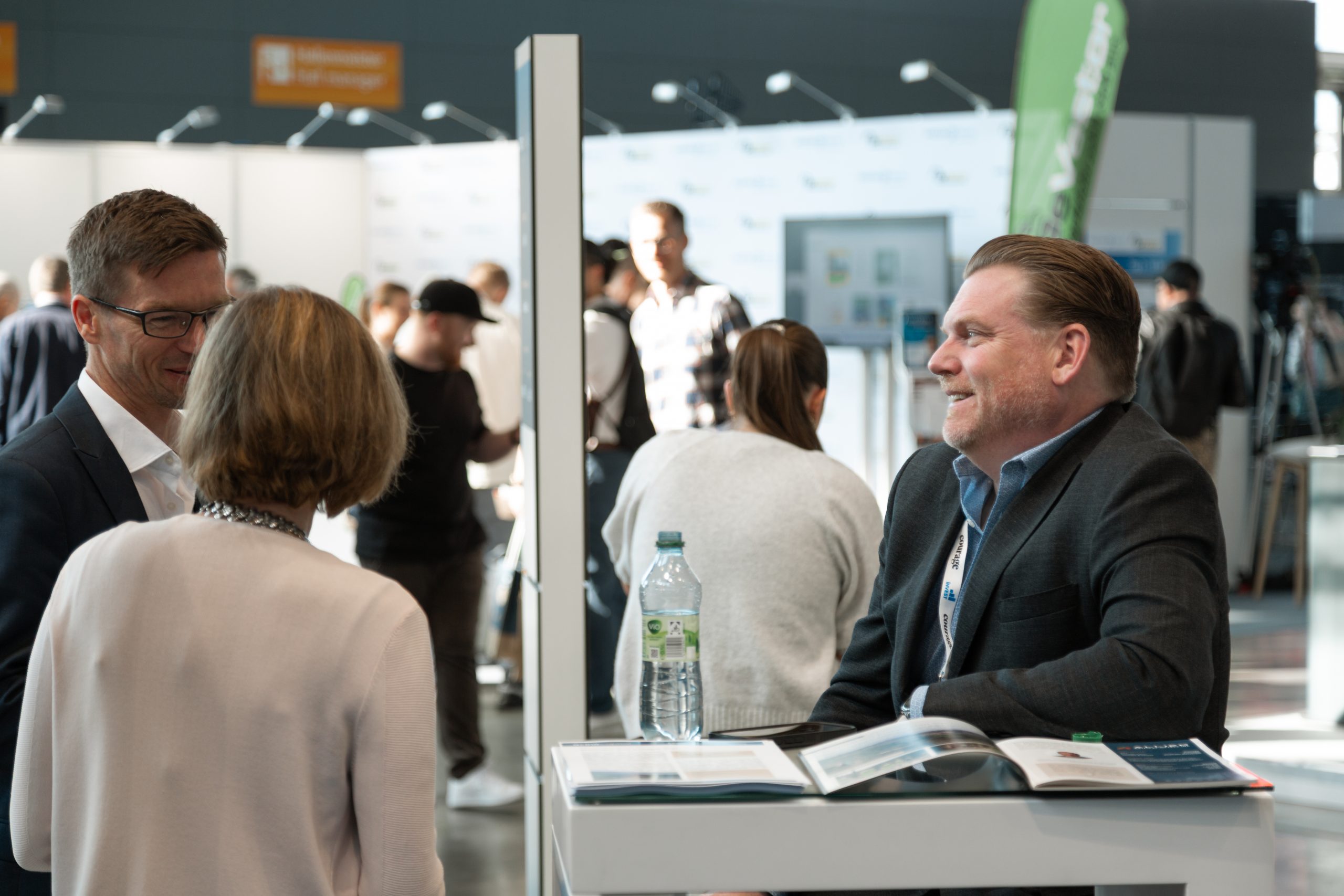 AXINO Mining Forum 2026 gallery image 1 showing investor conversations, mining company presentations and forum atmosphere in Stuttgart