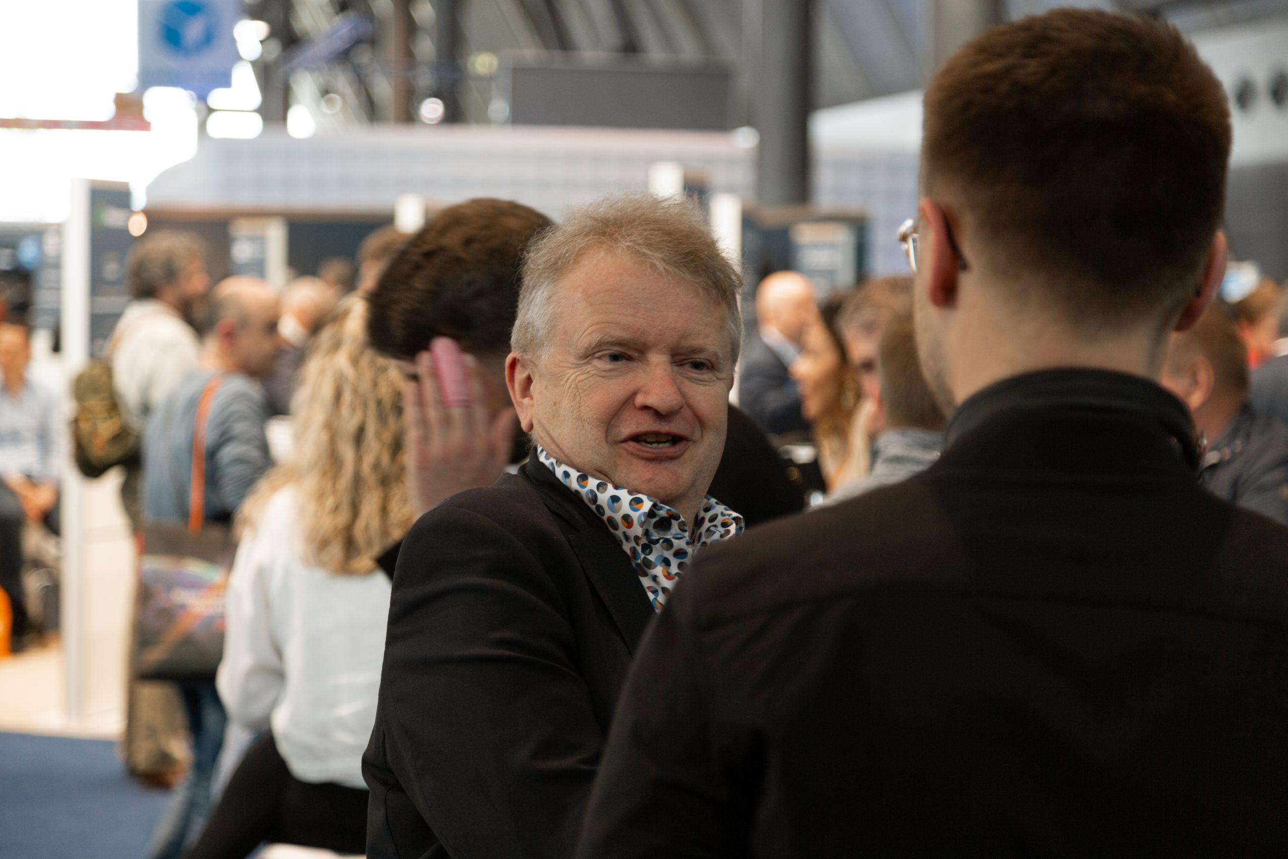 AXINO Mining Forum 2026 gallery image 11 showing investor conversations, mining company presentations and forum atmosphere in Stuttgart