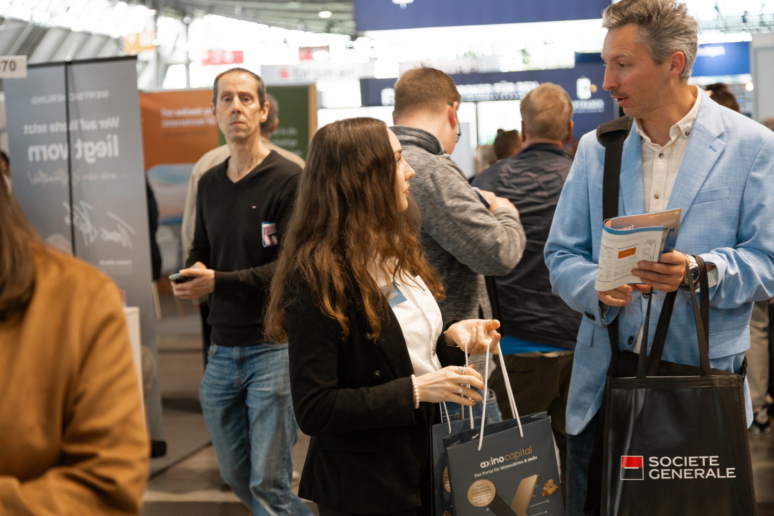 AXINO Mining Forum 2026 gallery image 12 showing investor conversations, mining company presentations and forum atmosphere in Stuttgart
