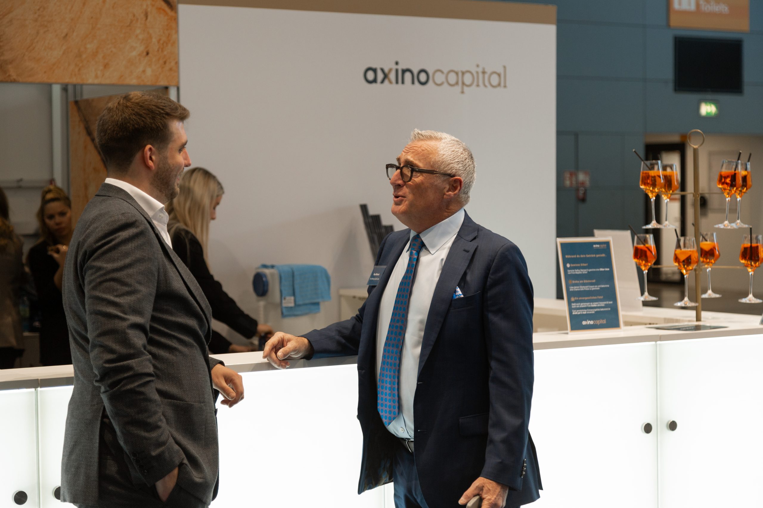 AXINO Mining Forum 2026 gallery image 15 showing investor conversations, mining company presentations and forum atmosphere in Stuttgart