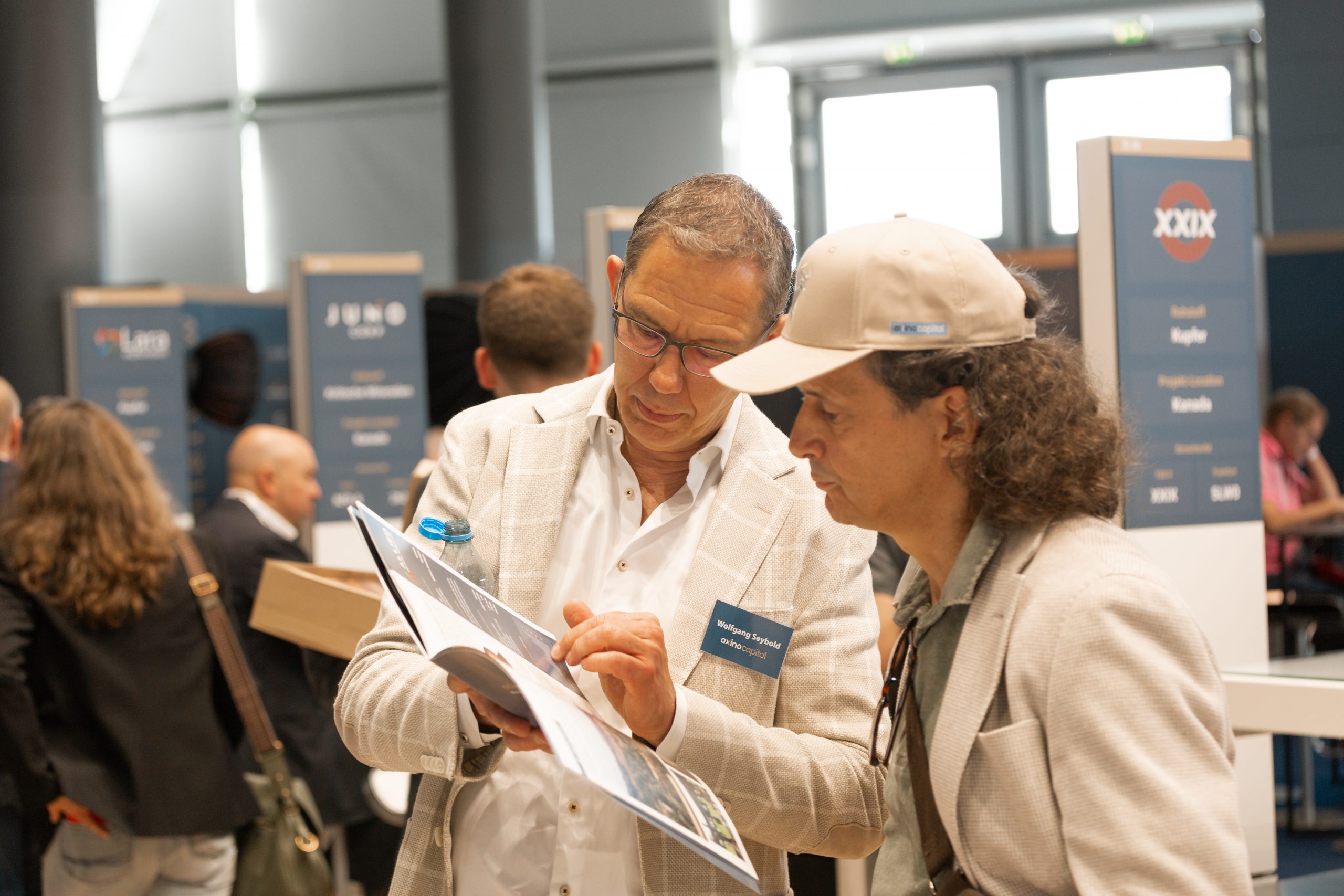 AXINO Mining Forum 2026 gallery image 20 showing investor conversations, mining company presentations and forum atmosphere in Stuttgart