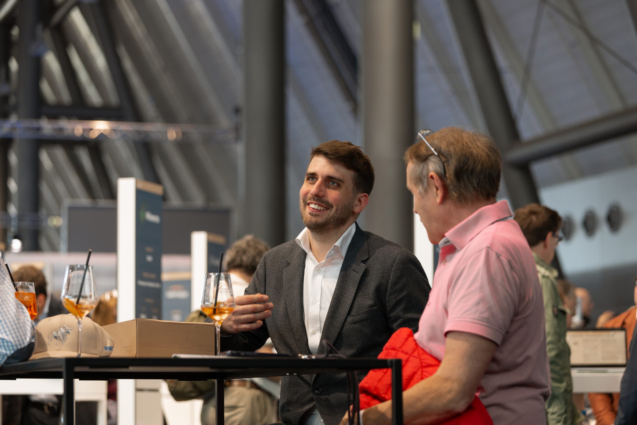 AXINO Mining Forum 2026 gallery image 21 showing investor conversations, mining company presentations and forum atmosphere in Stuttgart