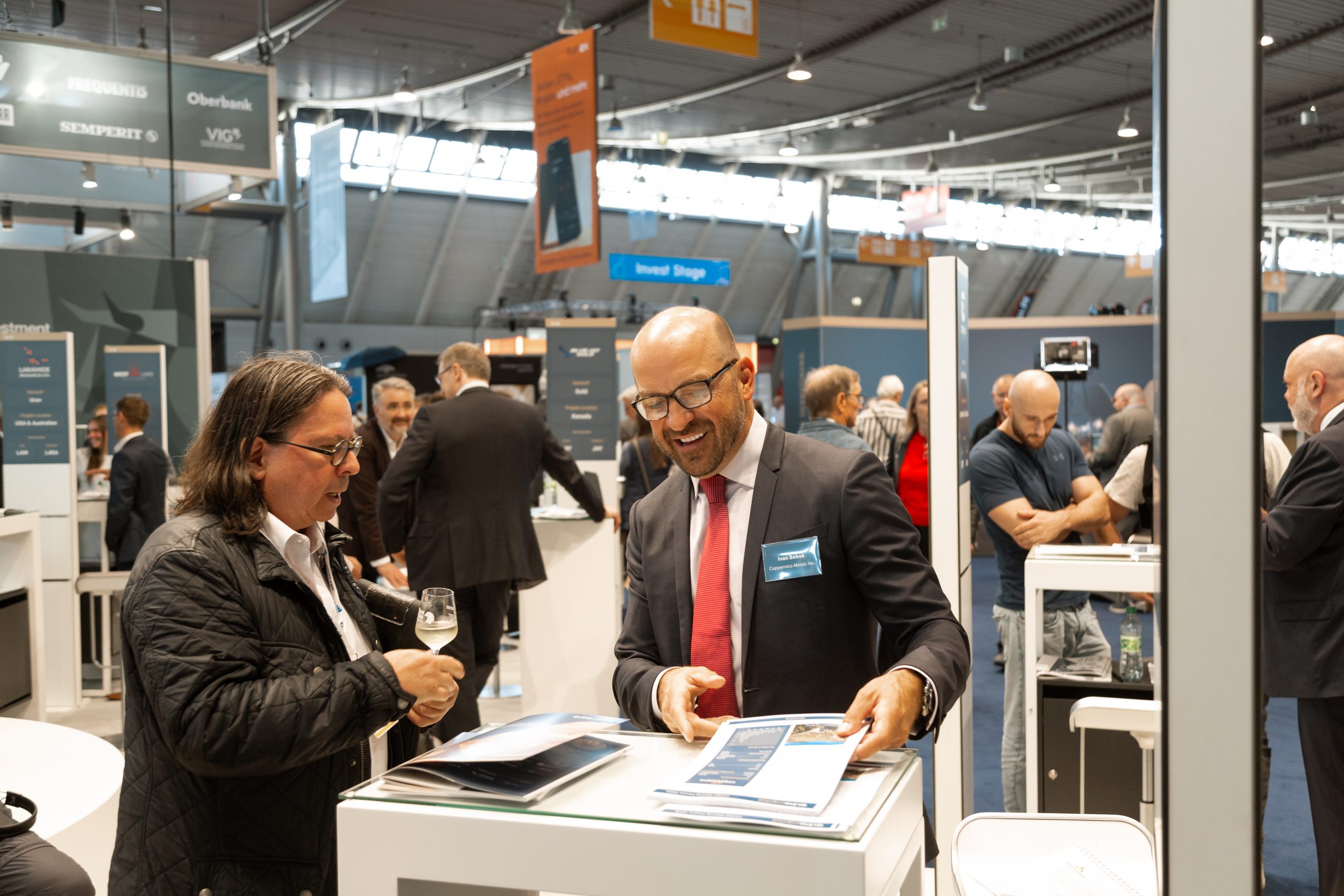 Mining company booth conversation with German investors at AXINO Mining Forum 2026